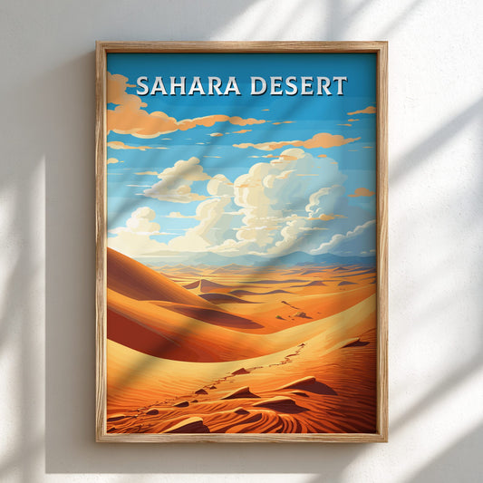 Framed artwork of the Sahara Desert with a blue sky and sand dunes.