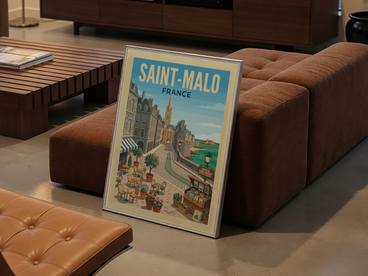 Saint Malo, France travel poster featuring a cobblestone street, historic buildings, and the sea.