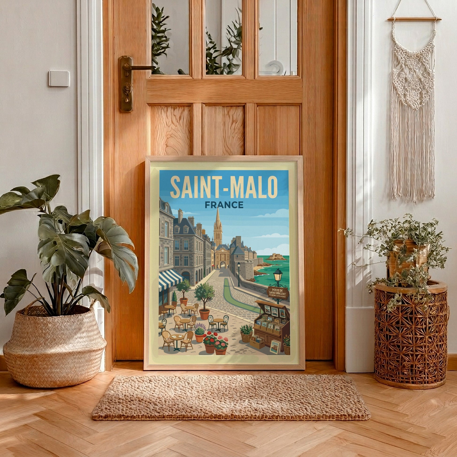 Saint Malo, France travel poster featuring a cobblestone street, historic buildings, and the sea.