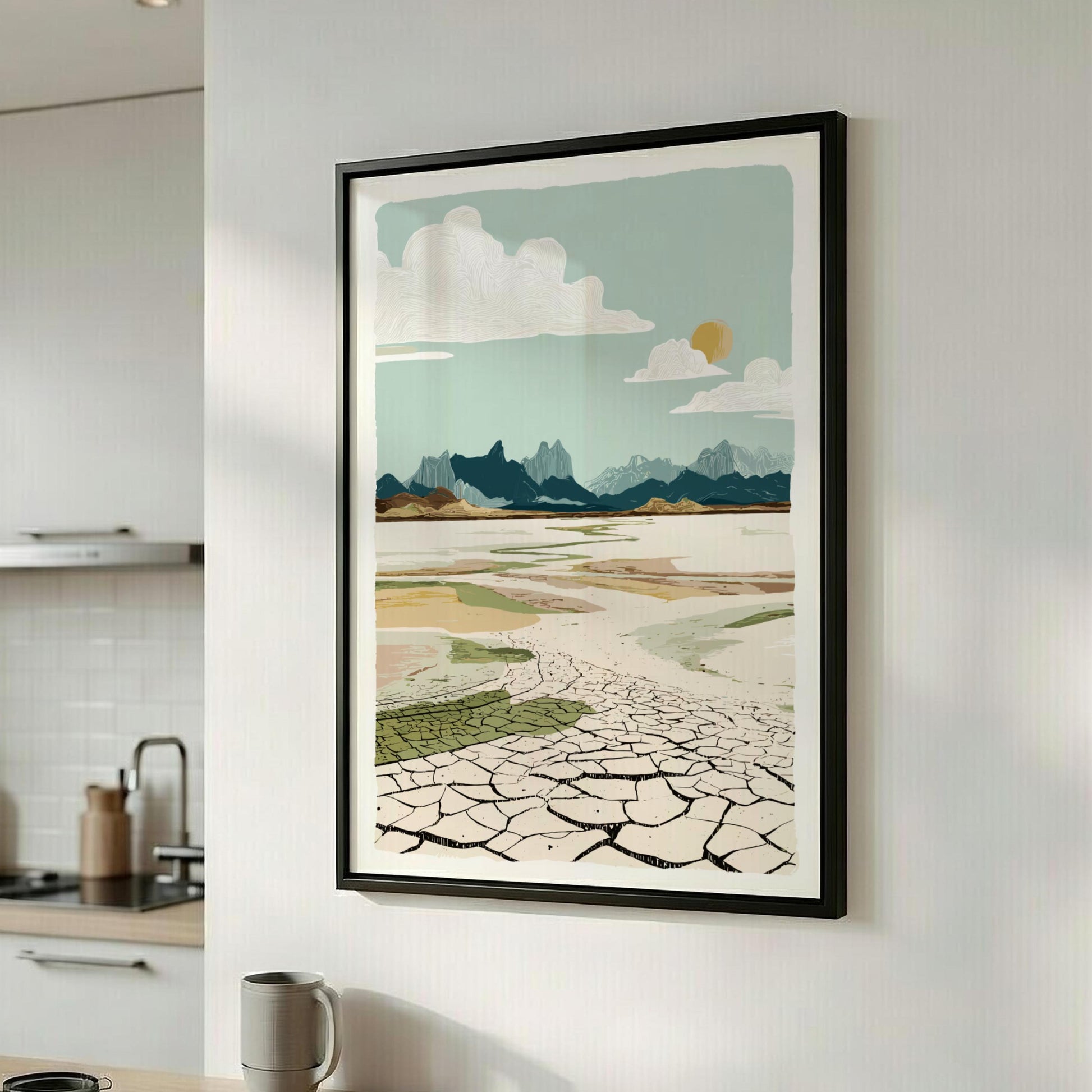Framed landscape print on a wall in a kitchen