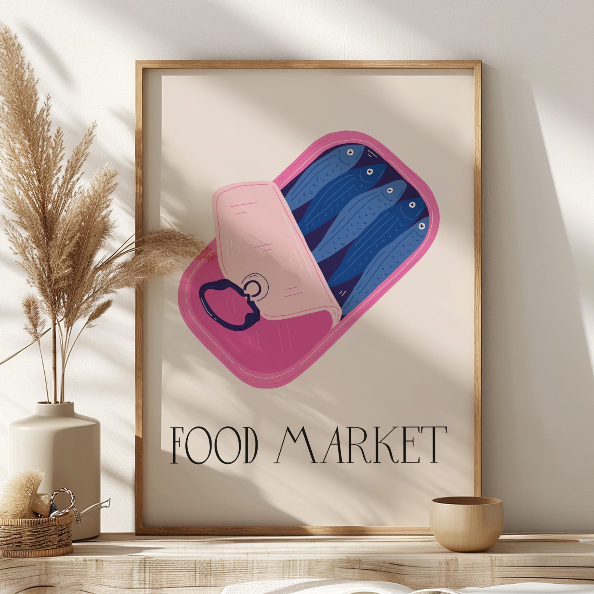 Framed artwork with a pink and blue abstract design and 'FOOD MARKET' text on a neutral wall.
