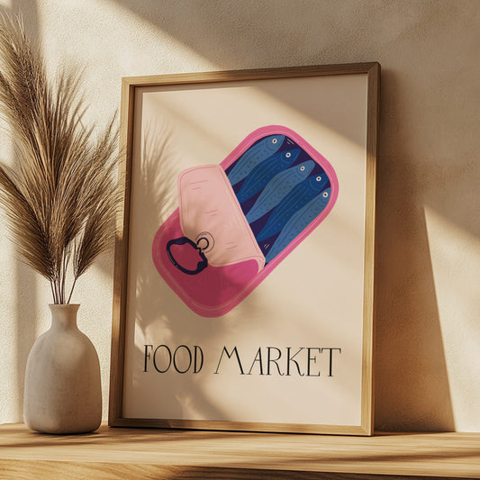 Framed artwork with a pink and blue abstract design and 'FOOD MARKET' text, placed on a wooden surface with a vase and plant.