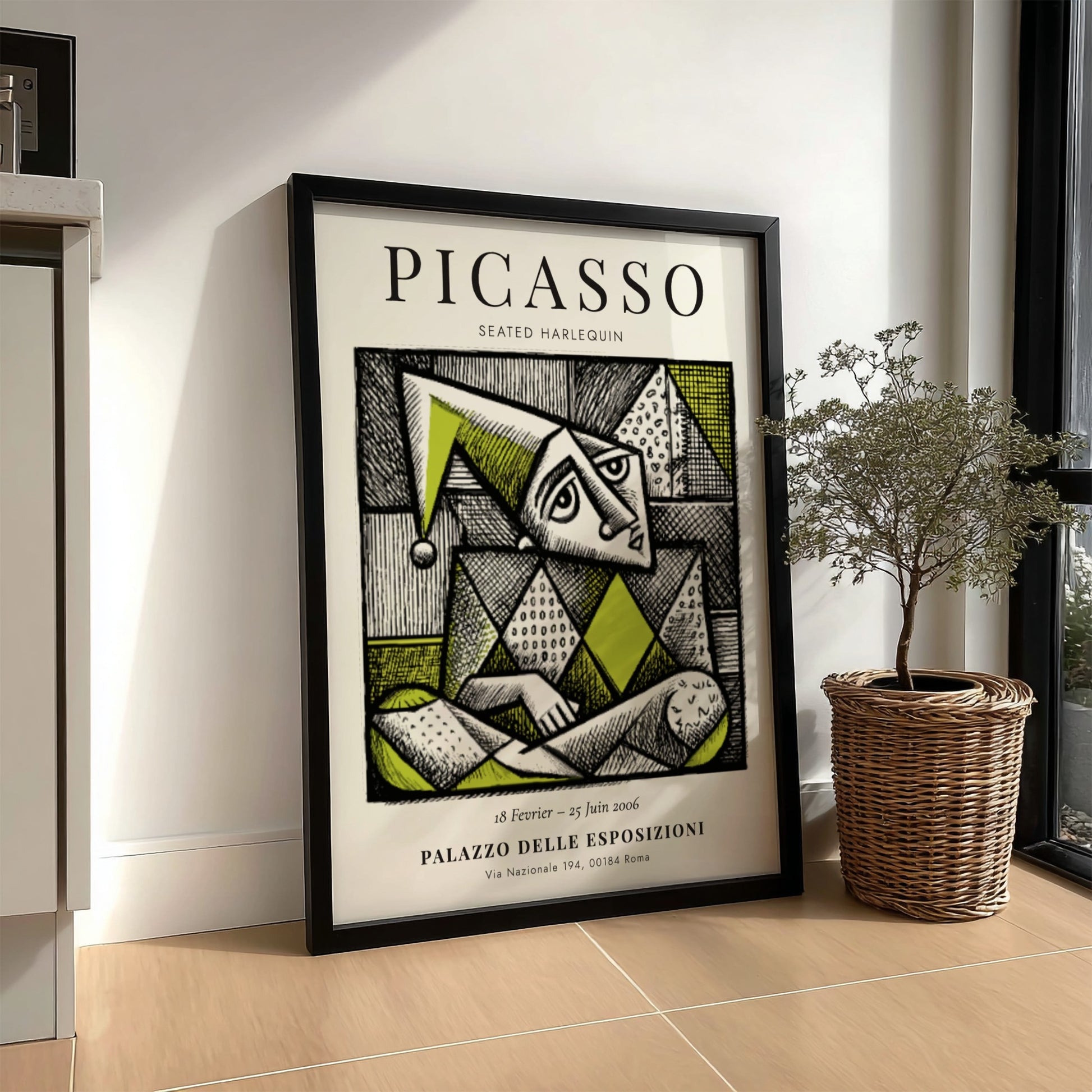 Seated Harlequin poster showcasing Picasso inspired geometric design in green and black.