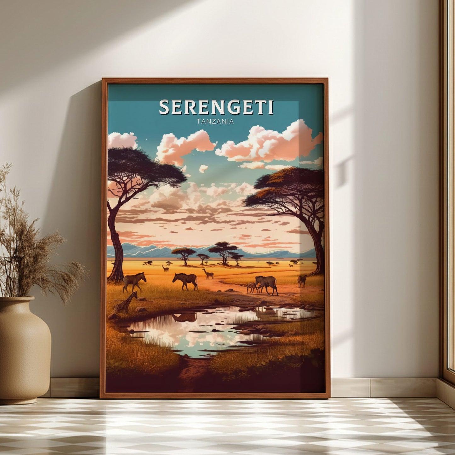 Framed Serengeti landscape poster on a wall with a vase and plant in the foreground.