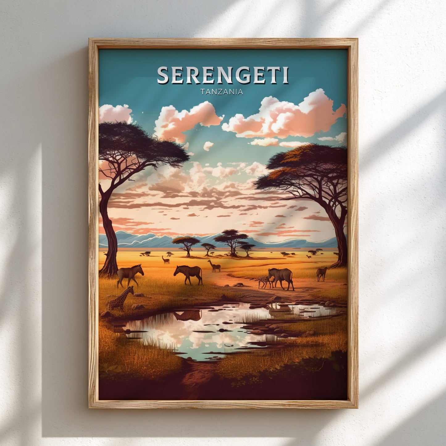 Framed artwork of the Serengeti landscape with animals and trees.