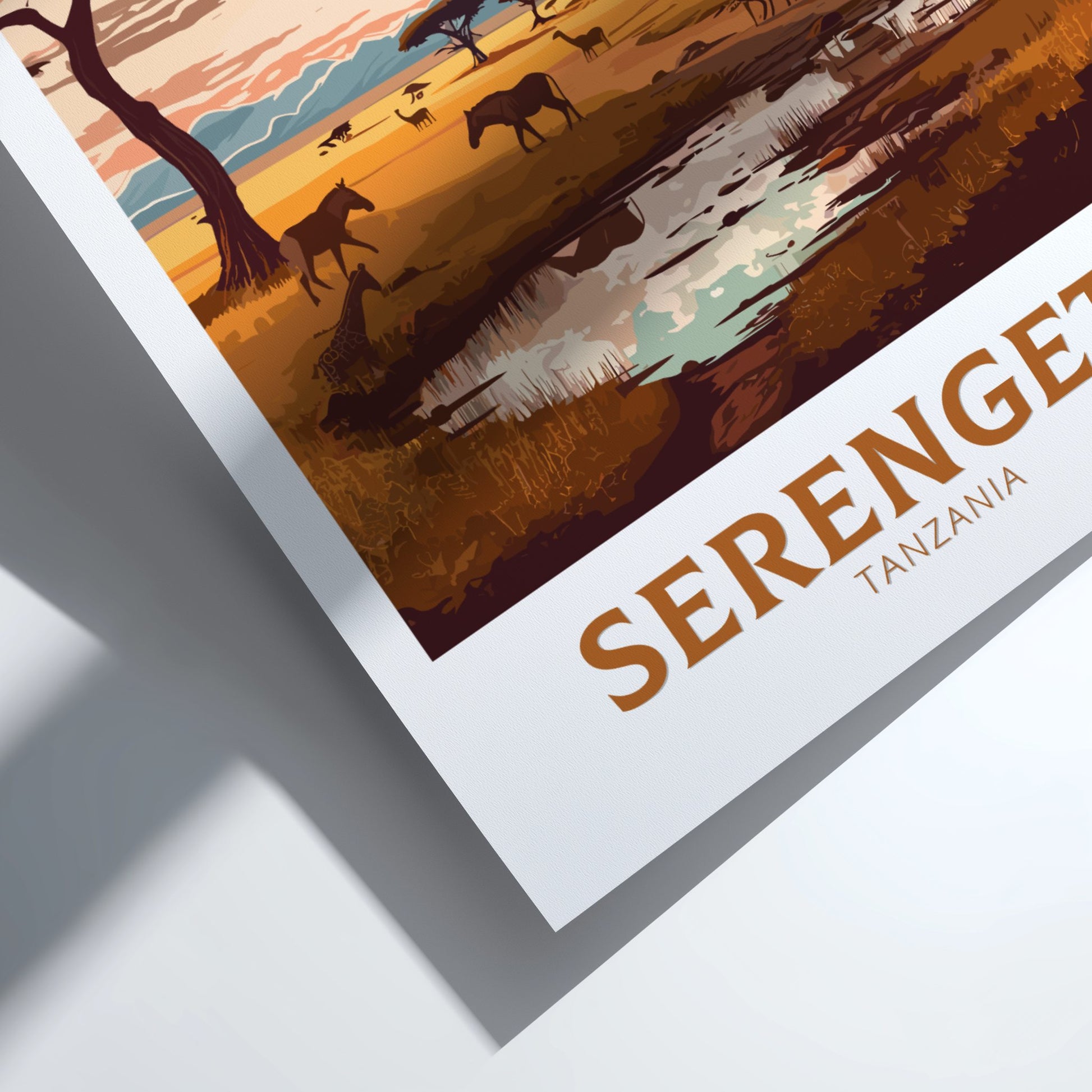 Framed artwork of a Serengeti landscape with animals and text.