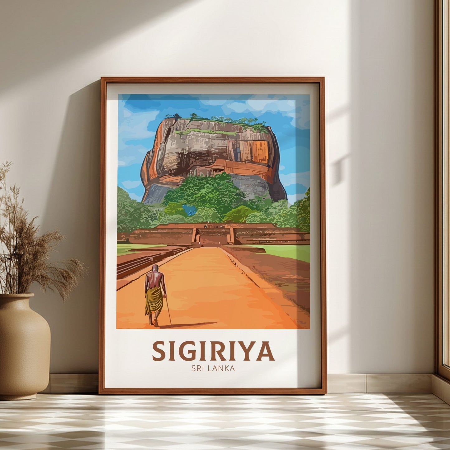 Framed poster of Sigiriya, Sri Lanka with a person walking towards it on a wooden floor.