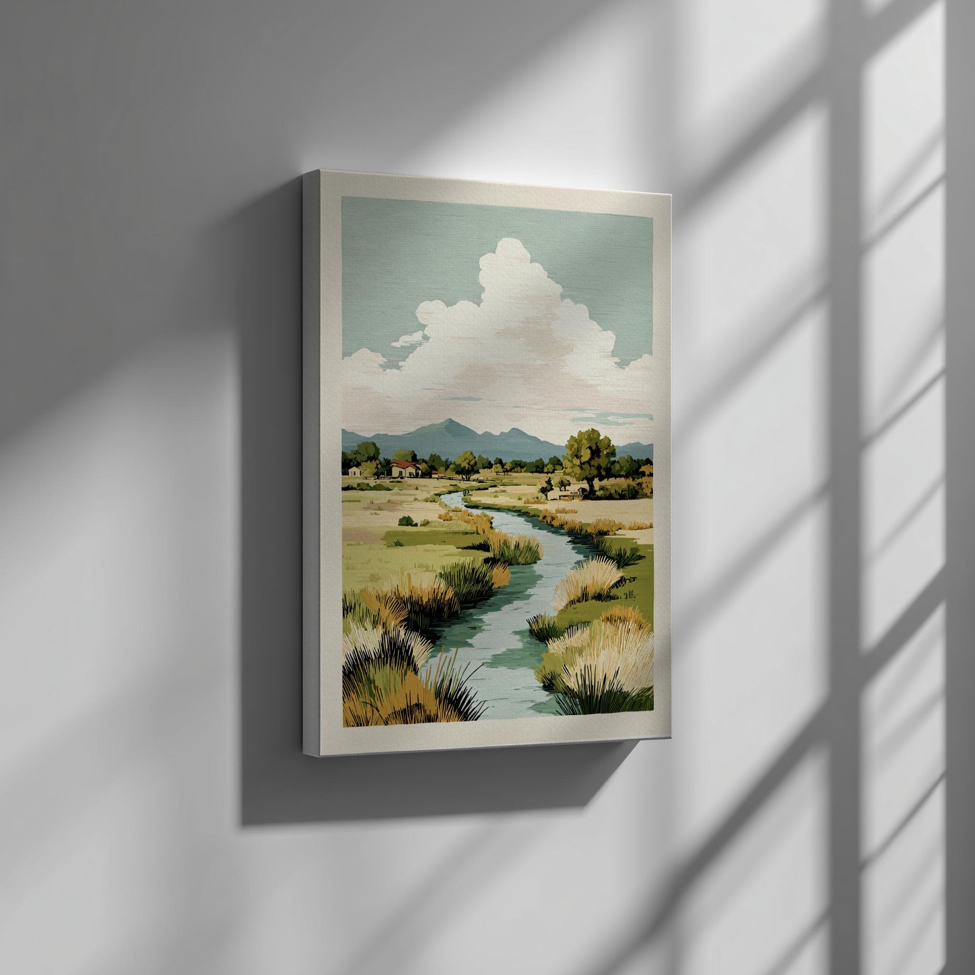 Framed landscape painting of a river and mountains on a wall with sunlight casting shadows.