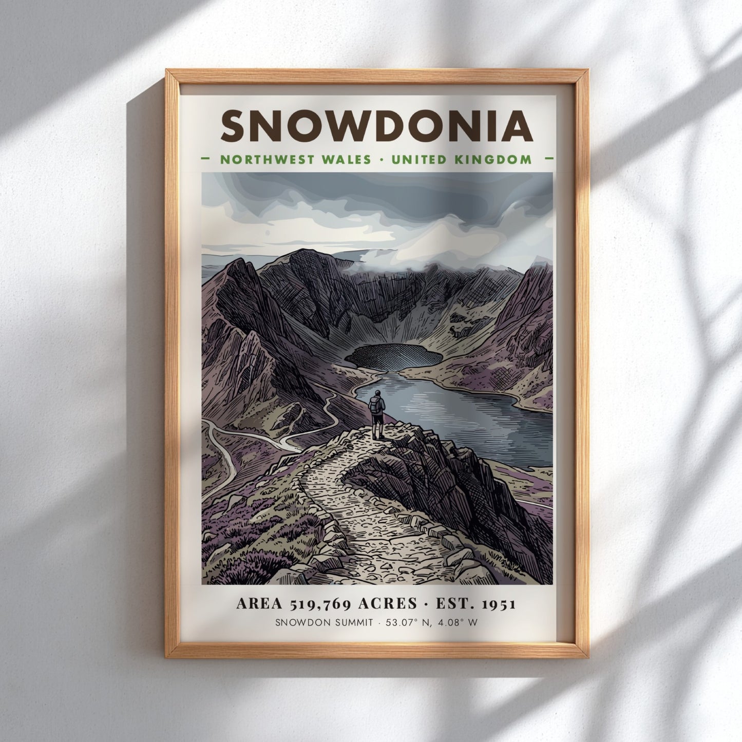 Poster featuring a hiker overlooking the dramatic, purple-toned mountains of Snowdonia, Wales, in
