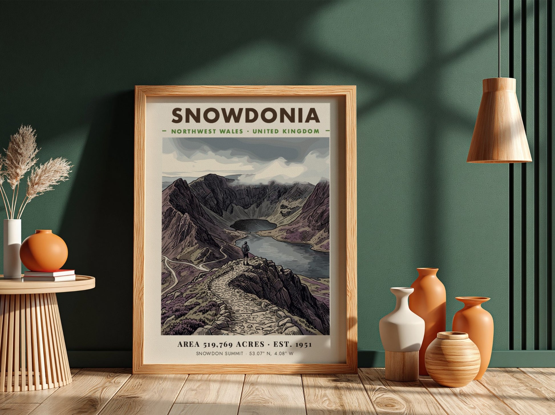 Poster featuring a hiker overlooking the dramatic, purple-toned mountains of Snowdonia, Wales, in