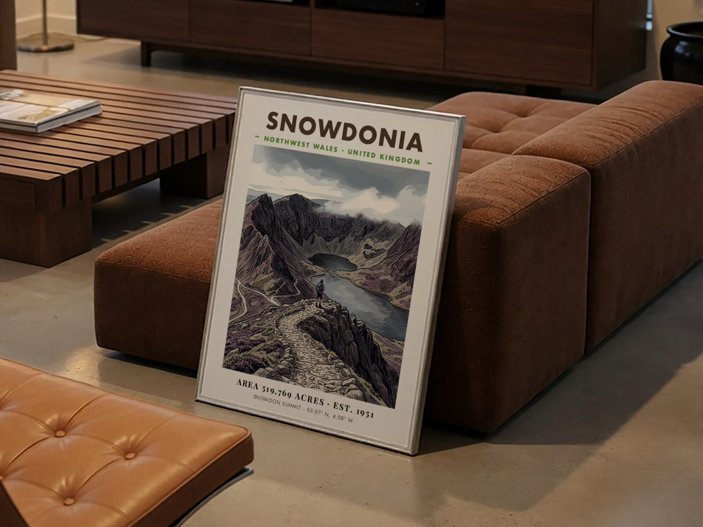 Poster featuring a hiker overlooking the dramatic, purple-toned mountains of Snowdonia, Wales, in