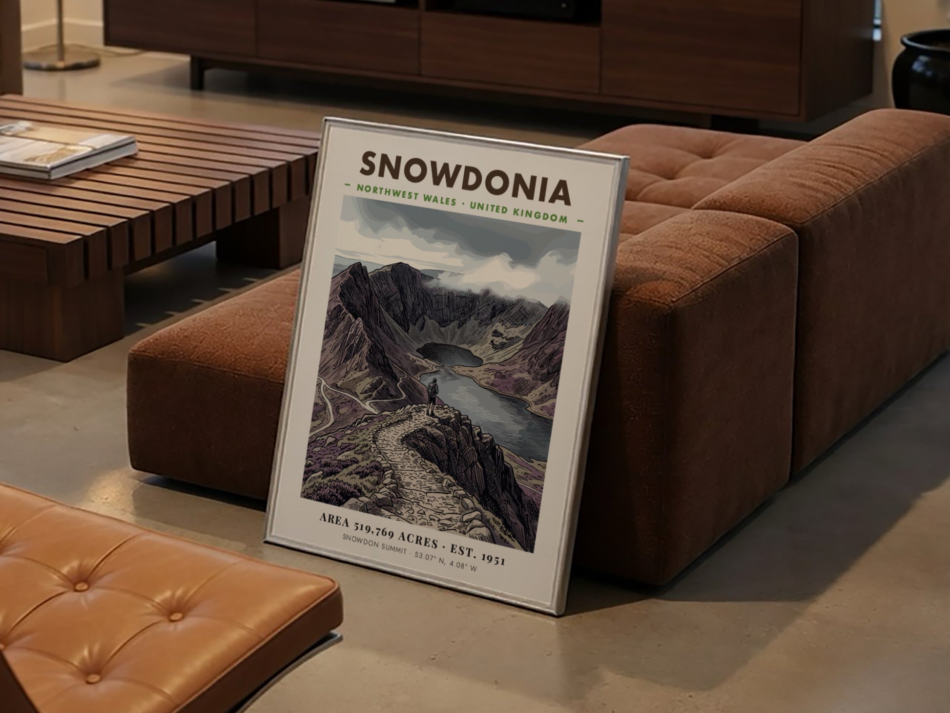 Poster featuring a hiker overlooking the dramatic, purple-toned mountains of Snowdonia, Wales, in