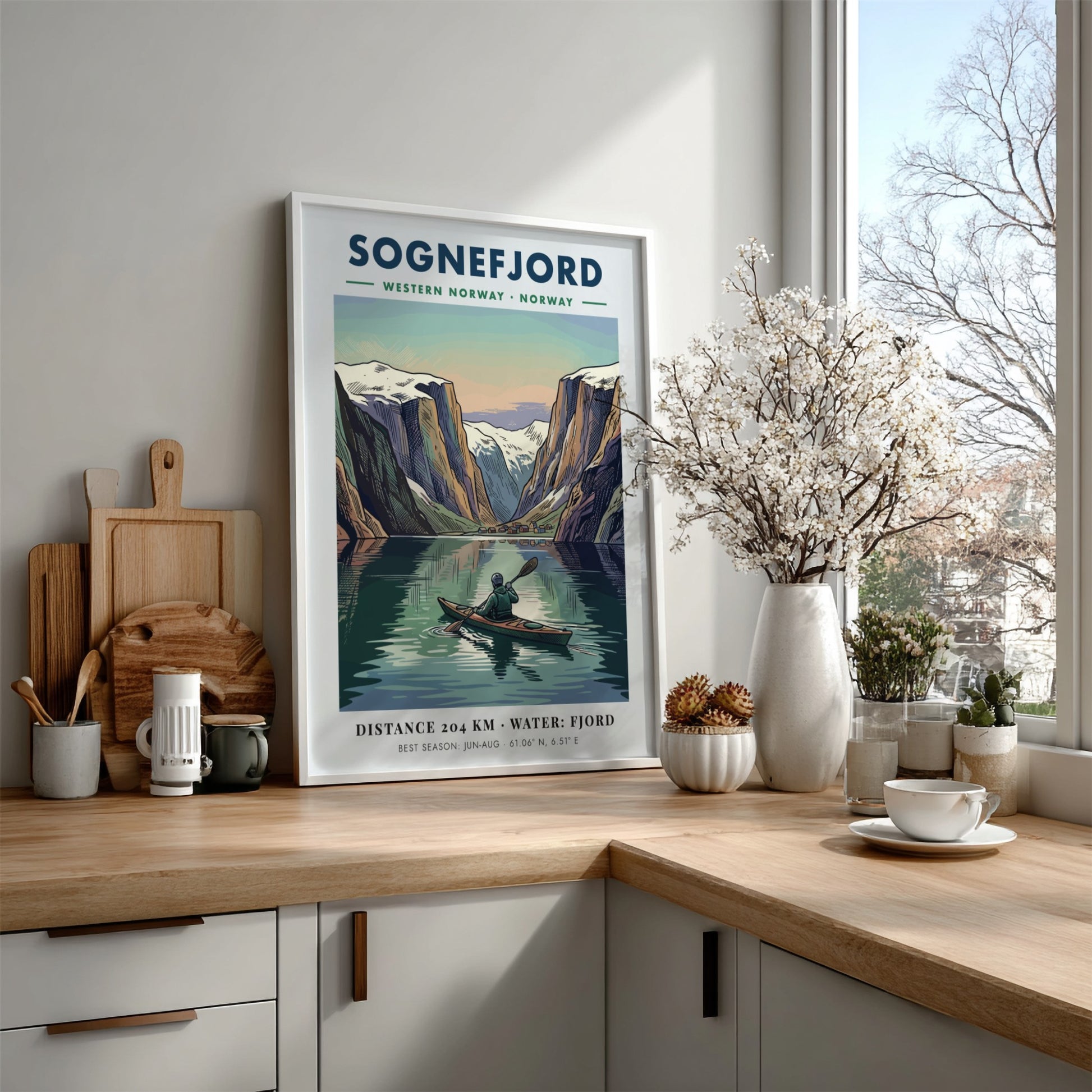 Poster of a kayaker on Sognefjord in Norway surrounded by towering snowy mountain peaks.