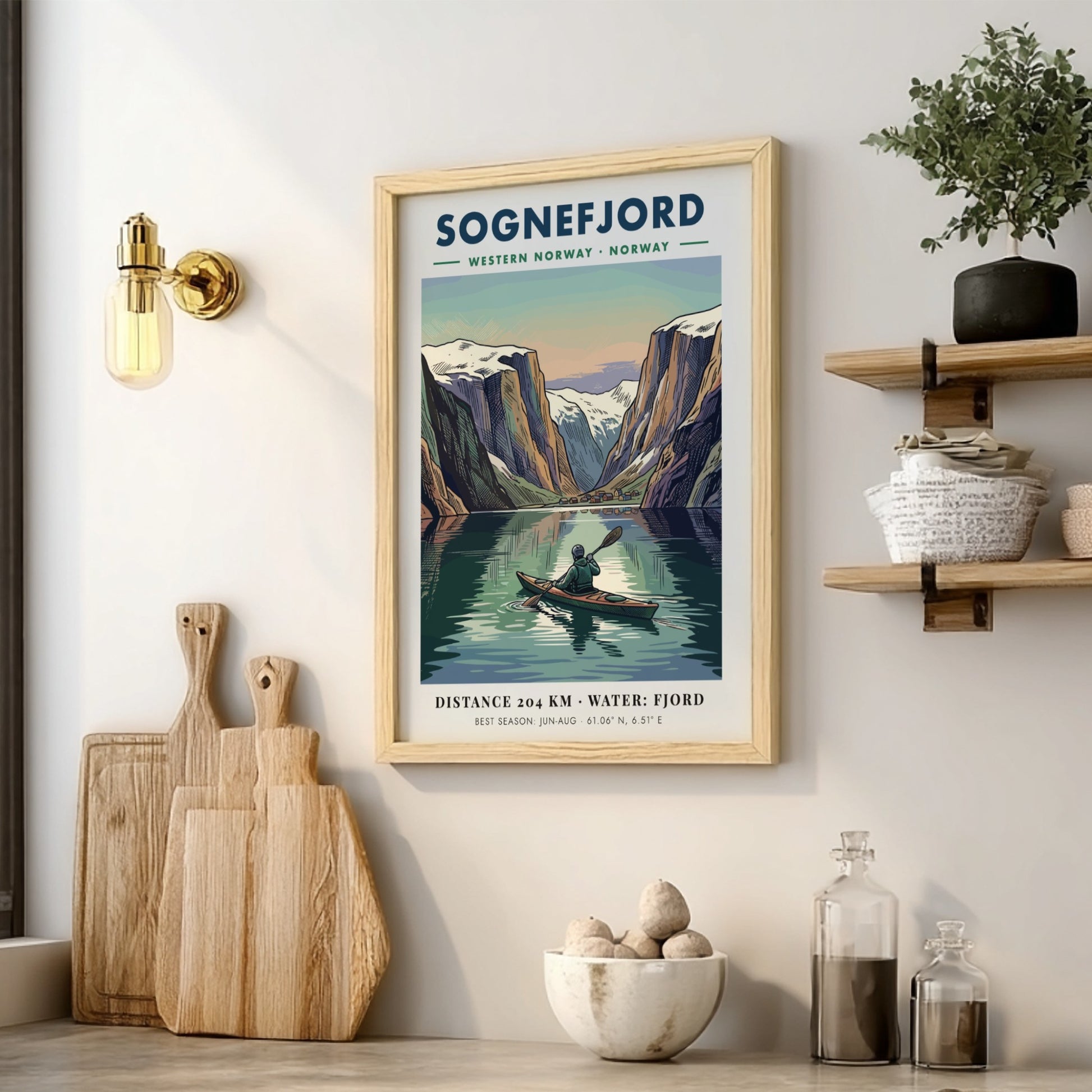 Poster of a kayaker on Sognefjord in Norway surrounded by towering snowy mountain peaks.