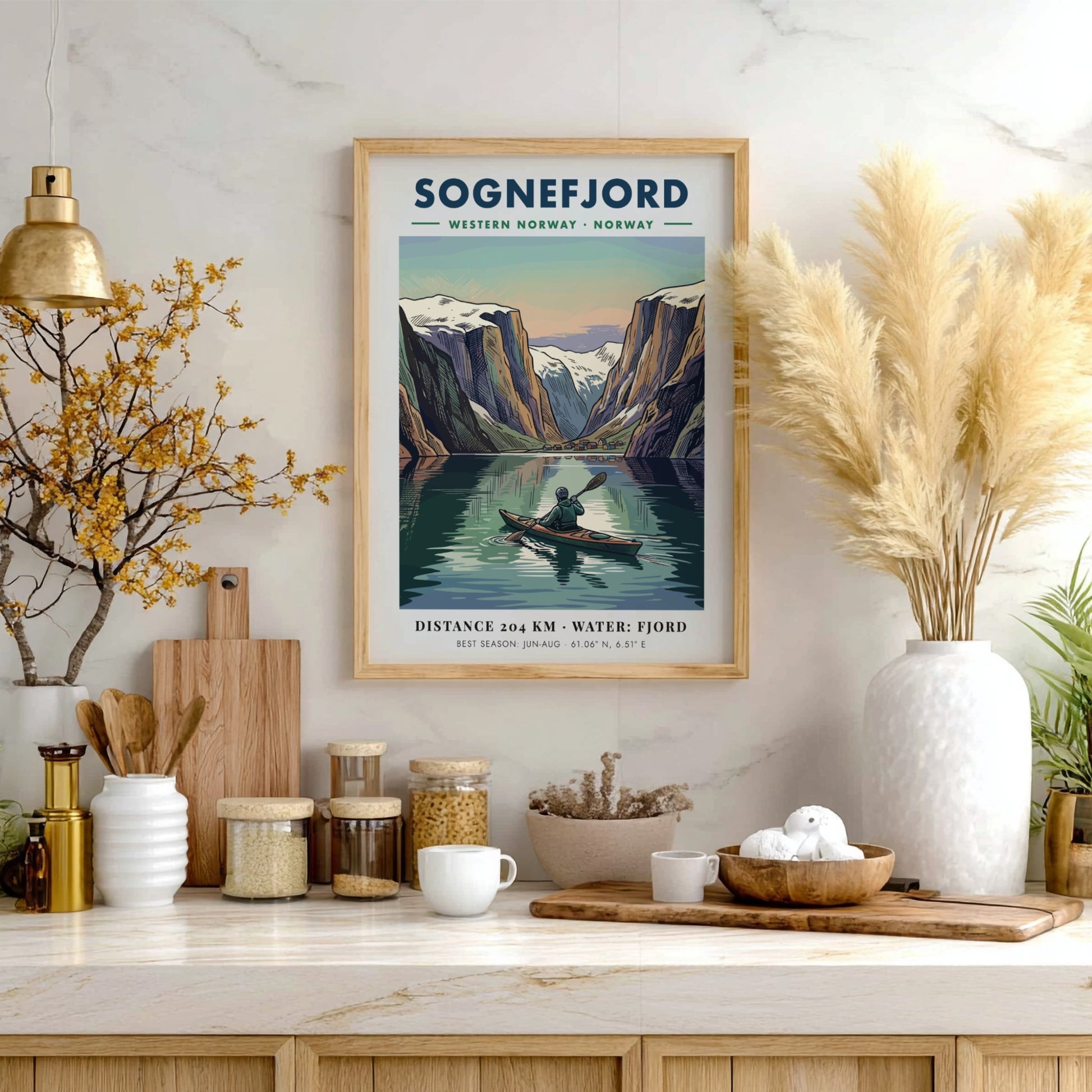 Poster of a kayaker on Sognefjord in Norway surrounded by towering snowy mountain peaks.