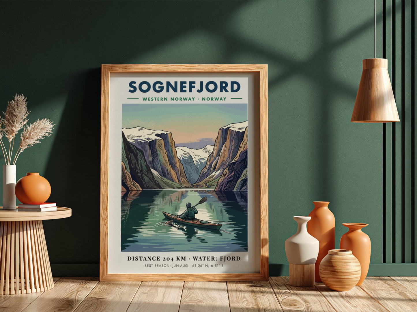 Poster of a kayaker on Sognefjord in Norway surrounded by towering snowy mountain peaks.