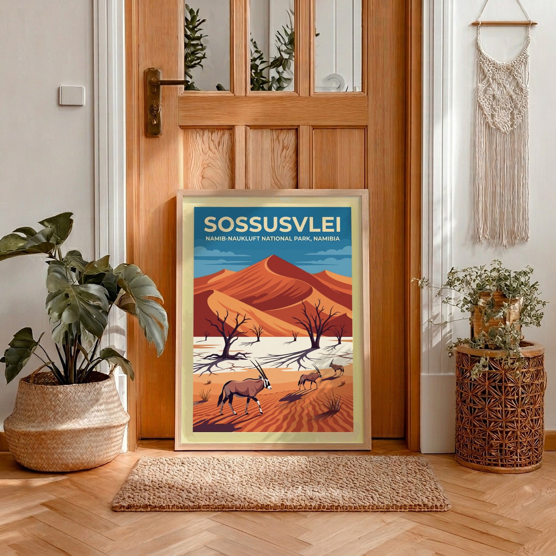 Travel poster of Sossusvlei featuring red dunes, gnarled trees, and gemsbok in Namibia.
