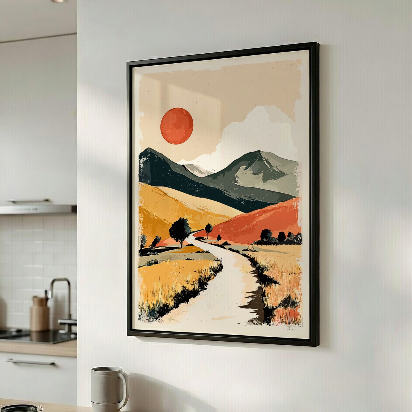 Framed landscape painting with a sun and mountains in a kitchen.