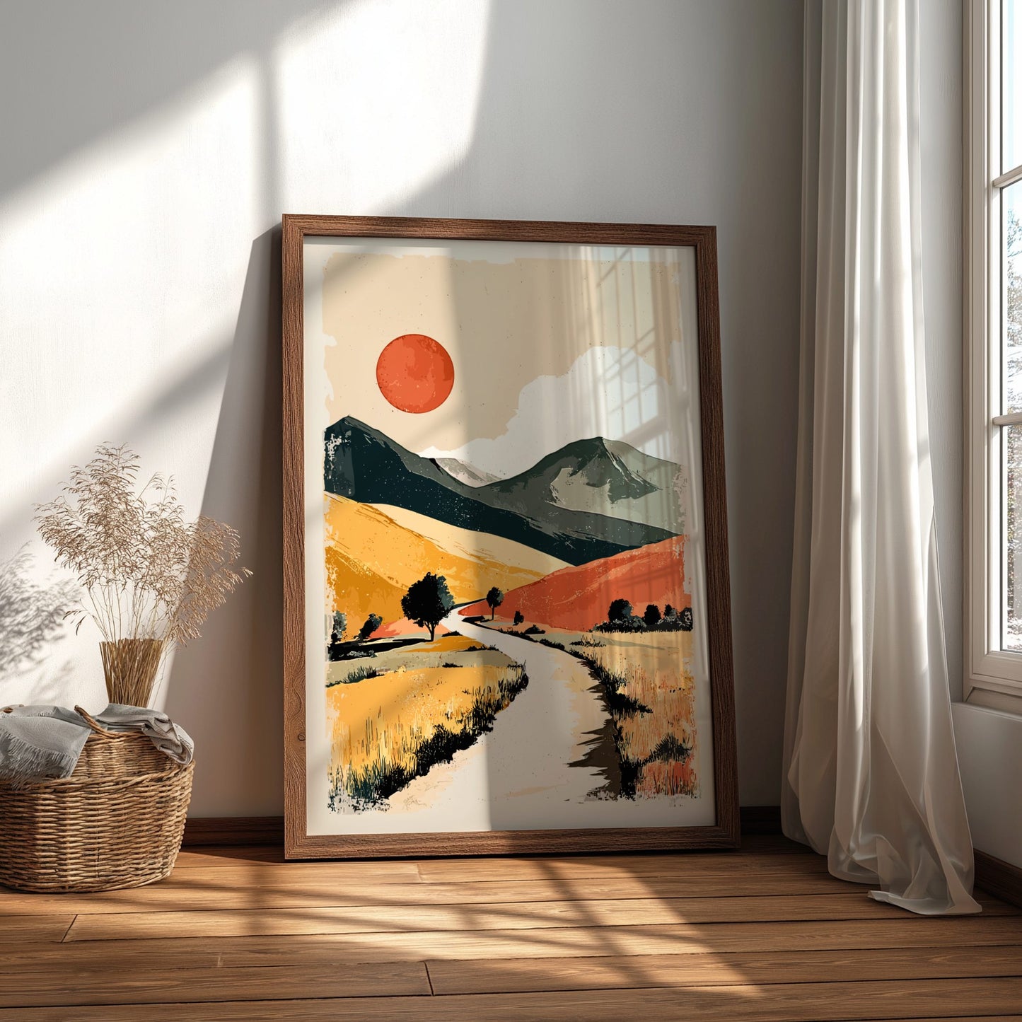 Framed abstract landscape art on a wall with natural light