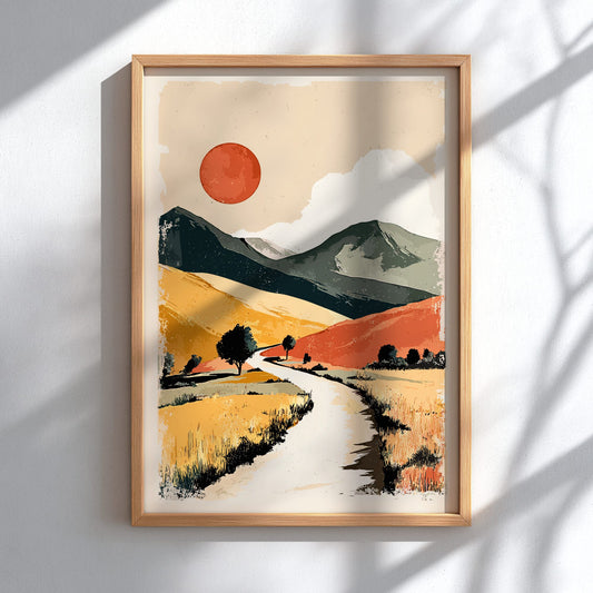 Framed abstract landscape painting with a red sun and mountains on a white wall.