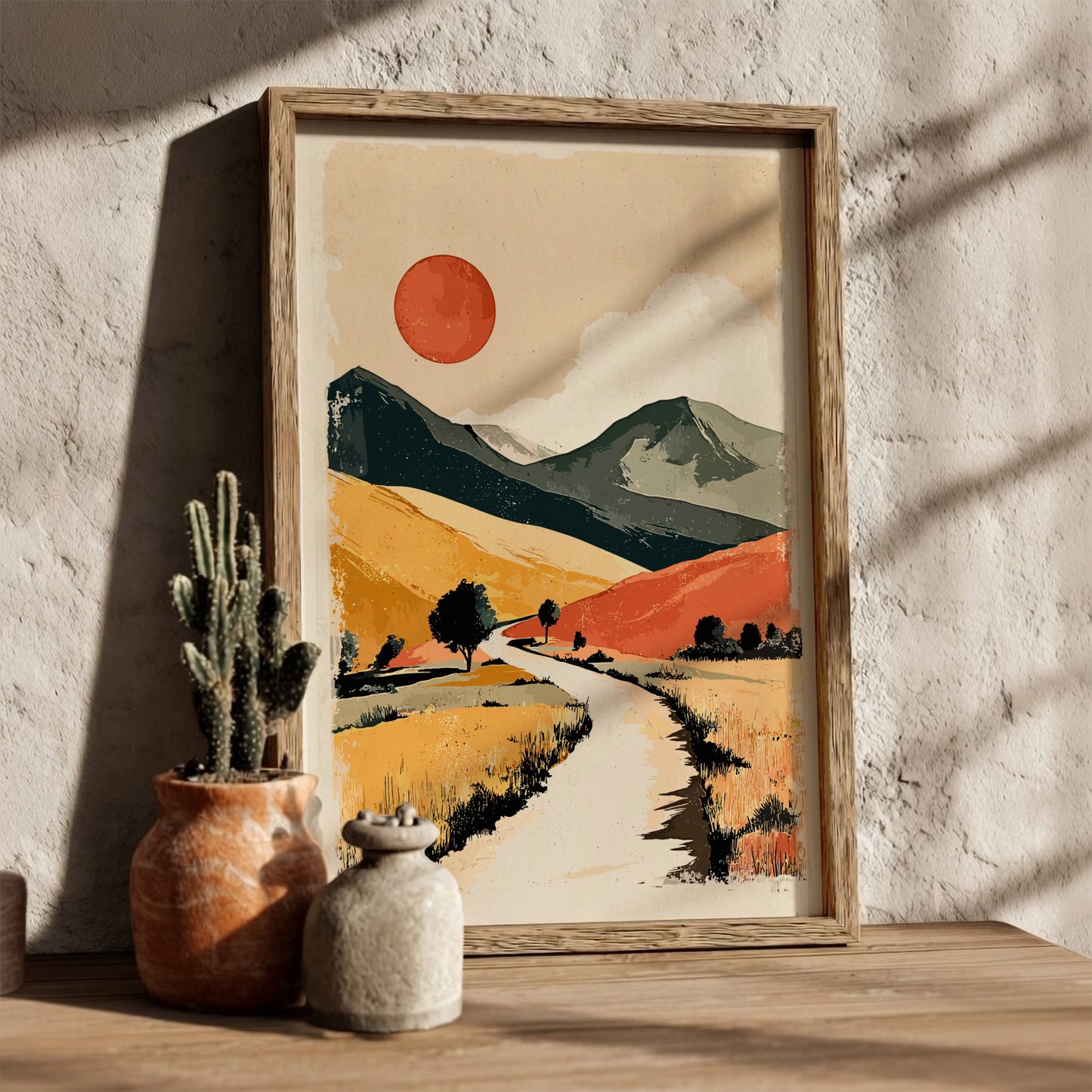 Framed abstract landscape art on a wall with natural light