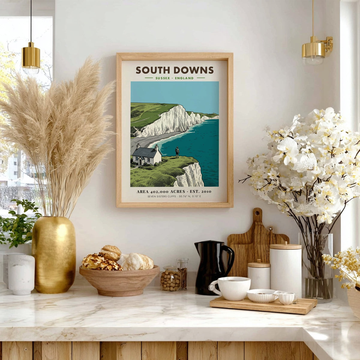 Poster of South Downs National Park featuring white cliffs, a cottage, and hiker.