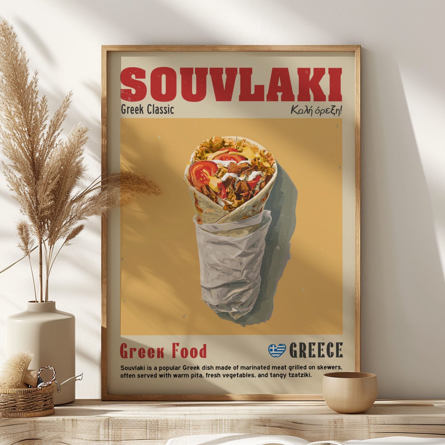 Framed poster of a souvlaki dish with 'Souvvlaki' text on a wall.