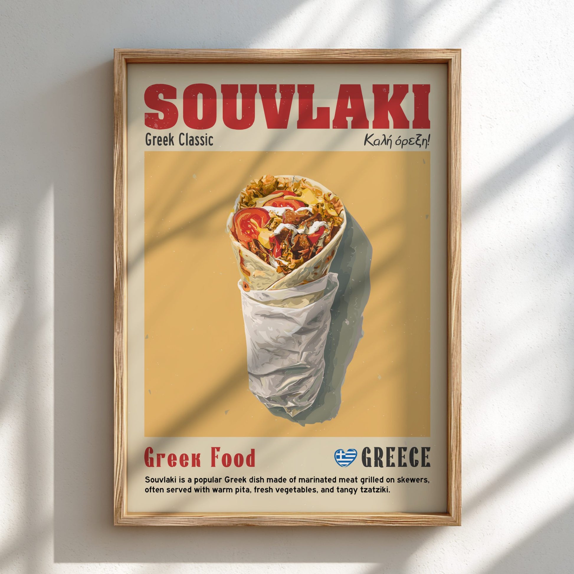 Framed poster of a souvlaki with 'Souvvlaki' text on a yellow background