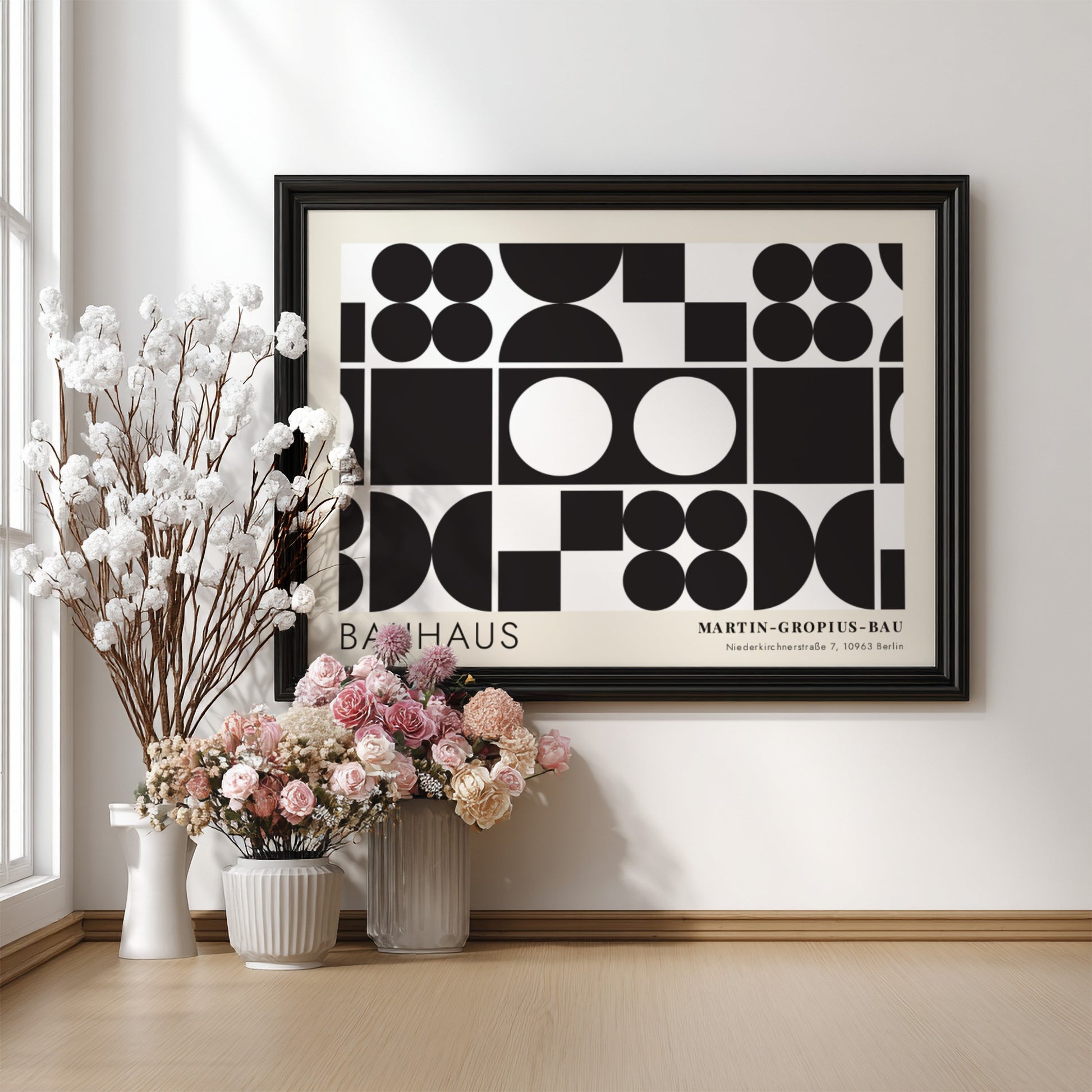 Bauhaus exhibition poster featuring geometric black shapes and white circles by Oskar Schlemmer