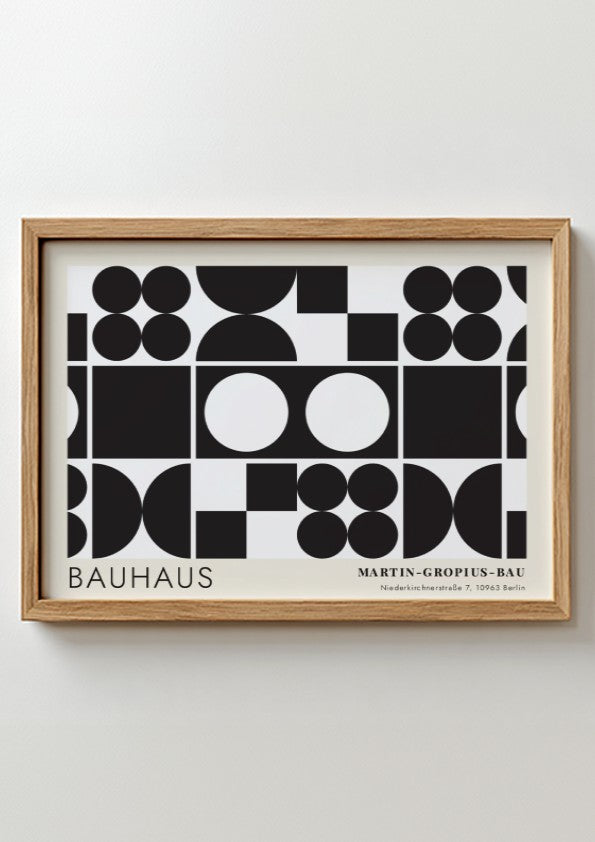 Bauhaus exhibition poster featuring geometric black shapes and white circles by Oskar Schlemmer