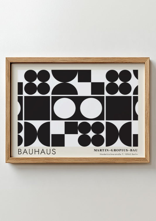 Bauhaus exhibition poster featuring geometric black shapes and white circles by Oskar Schlemmer