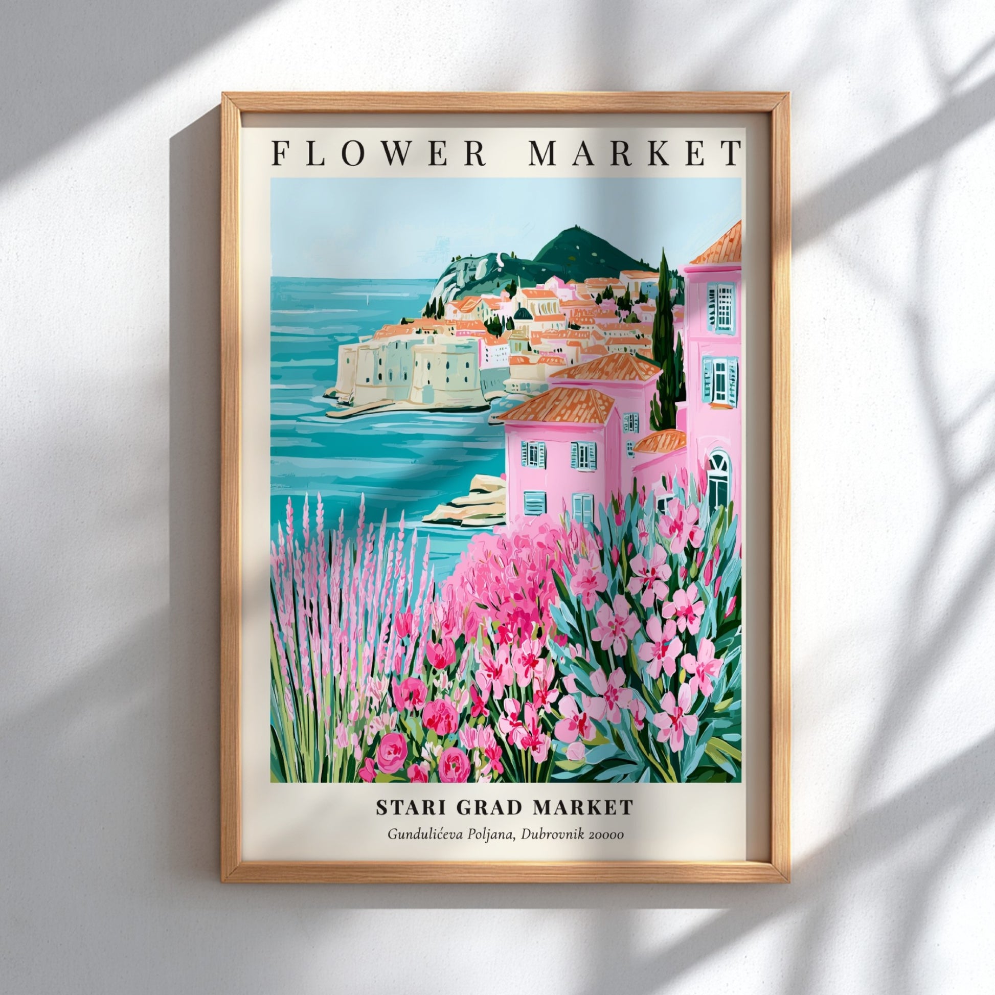 Coastal wall decor featuring pink flowers and Mediterranean scenery in vibrant colors