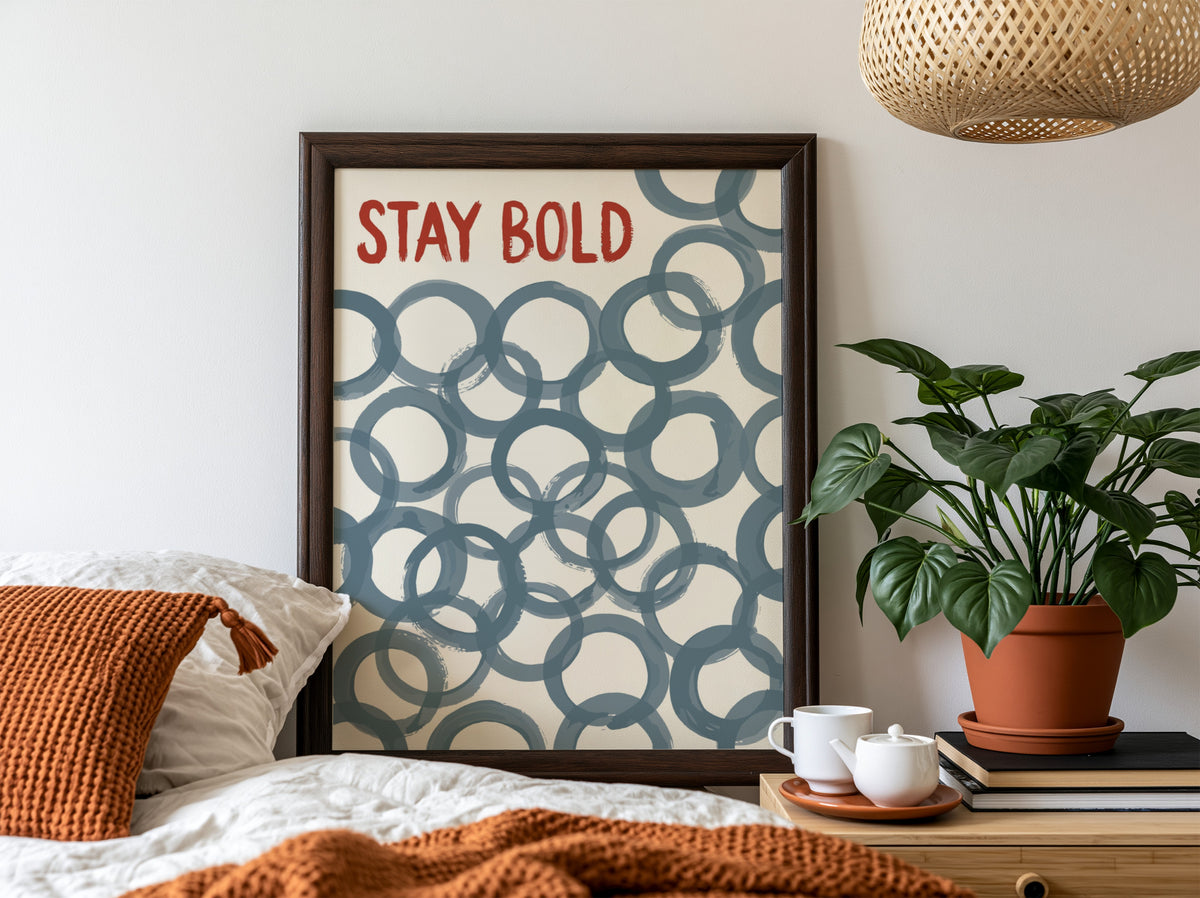 Motivational poster with Stay Bold text in orange over slate blue circle patterns.