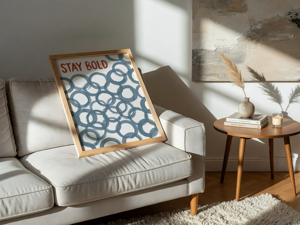 Motivational poster with Stay Bold text in orange over slate blue circle patterns.
