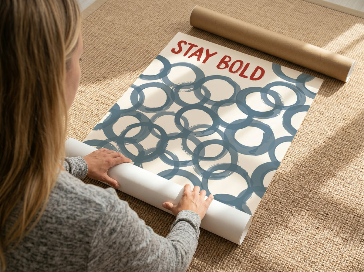 Motivational poster with Stay Bold text in orange over slate blue circle patterns.