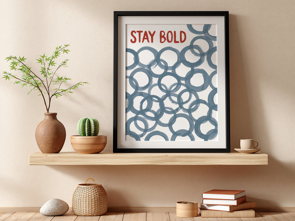Motivational poster with Stay Bold text in orange over slate blue circle patterns.
