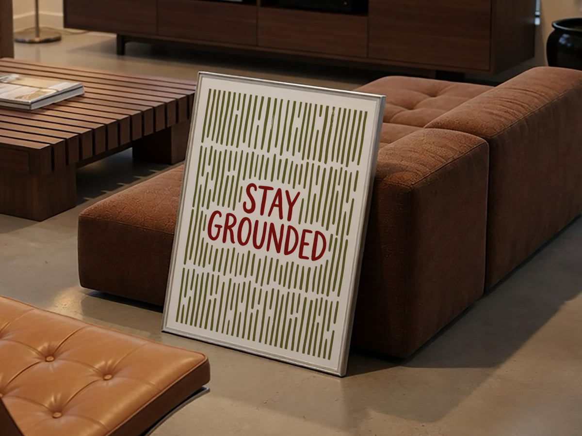 Motivational poster with Stay Grounded text over a pattern of vertical olive lines