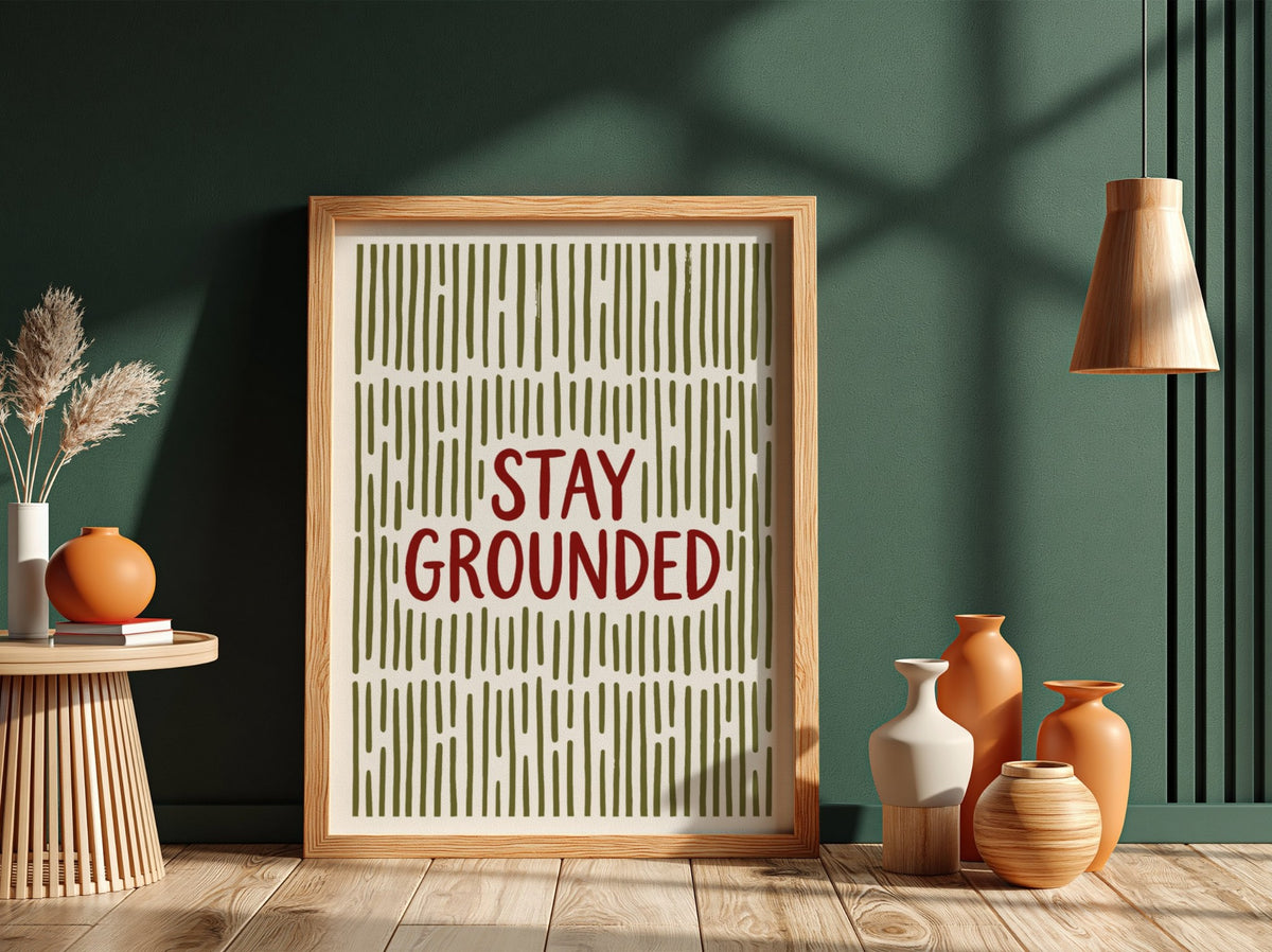 Motivational poster with Stay Grounded text over a pattern of vertical olive lines