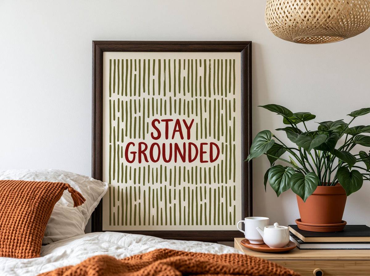 Motivational poster with Stay Grounded text over a pattern of vertical olive lines