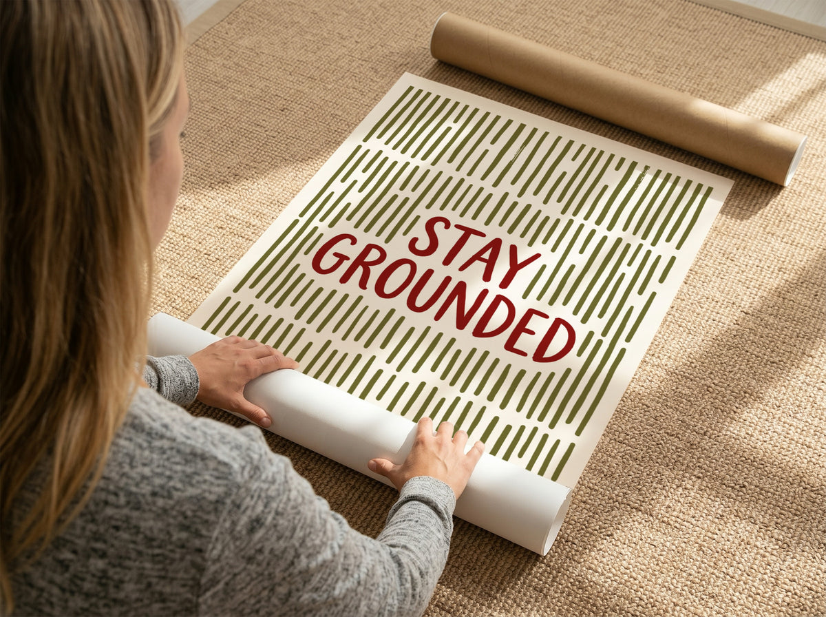 Motivational poster with Stay Grounded text over a pattern of vertical olive lines