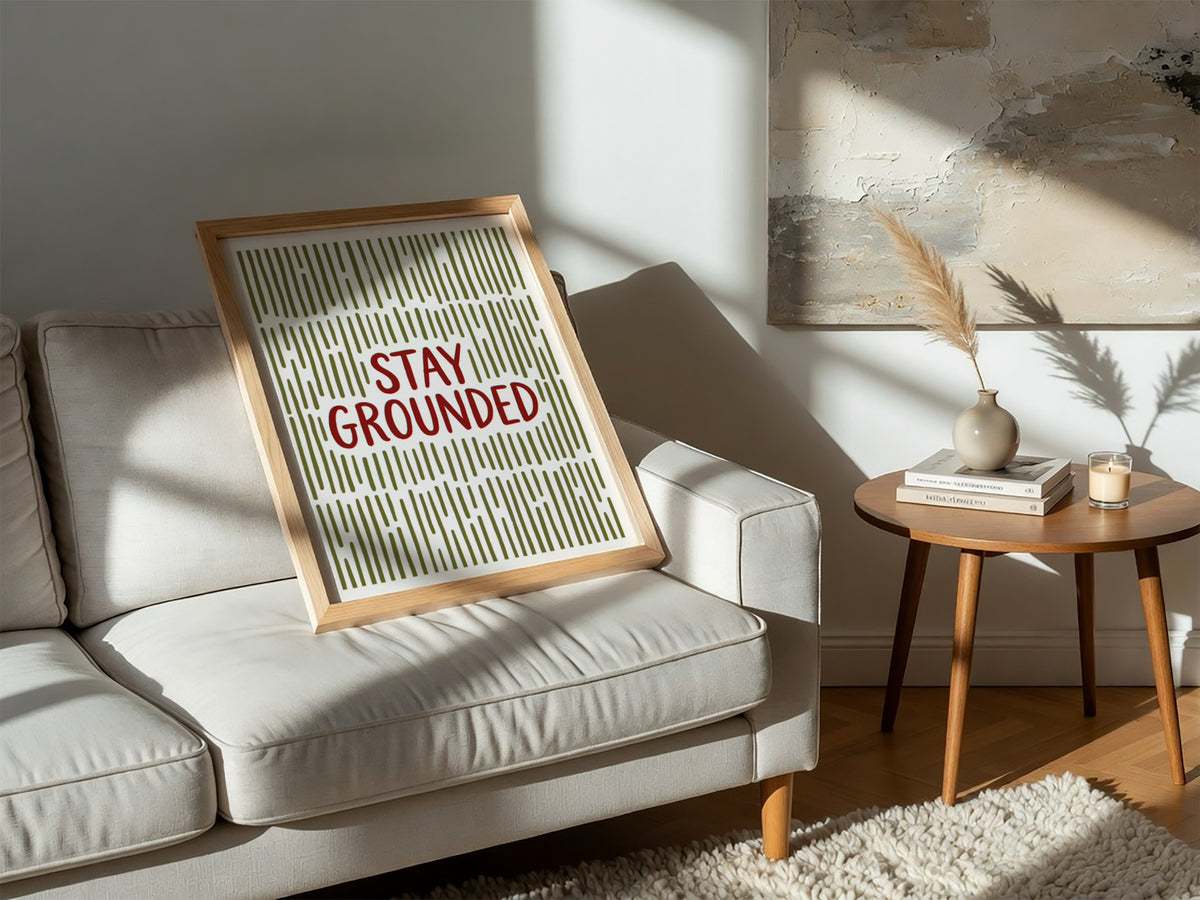 Motivational poster with Stay Grounded text over a pattern of vertical olive lines
