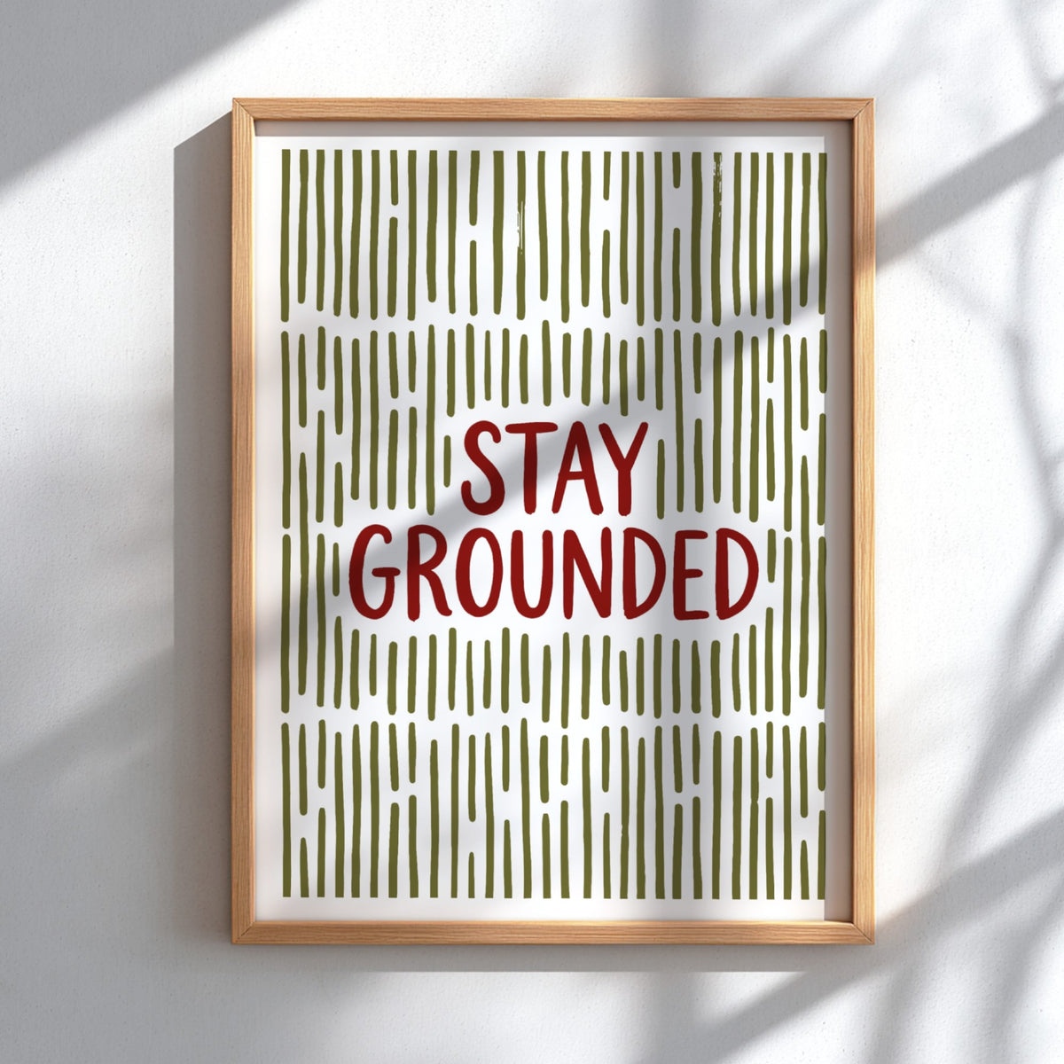 Motivational poster with Stay Grounded text over a pattern of vertical olive lines