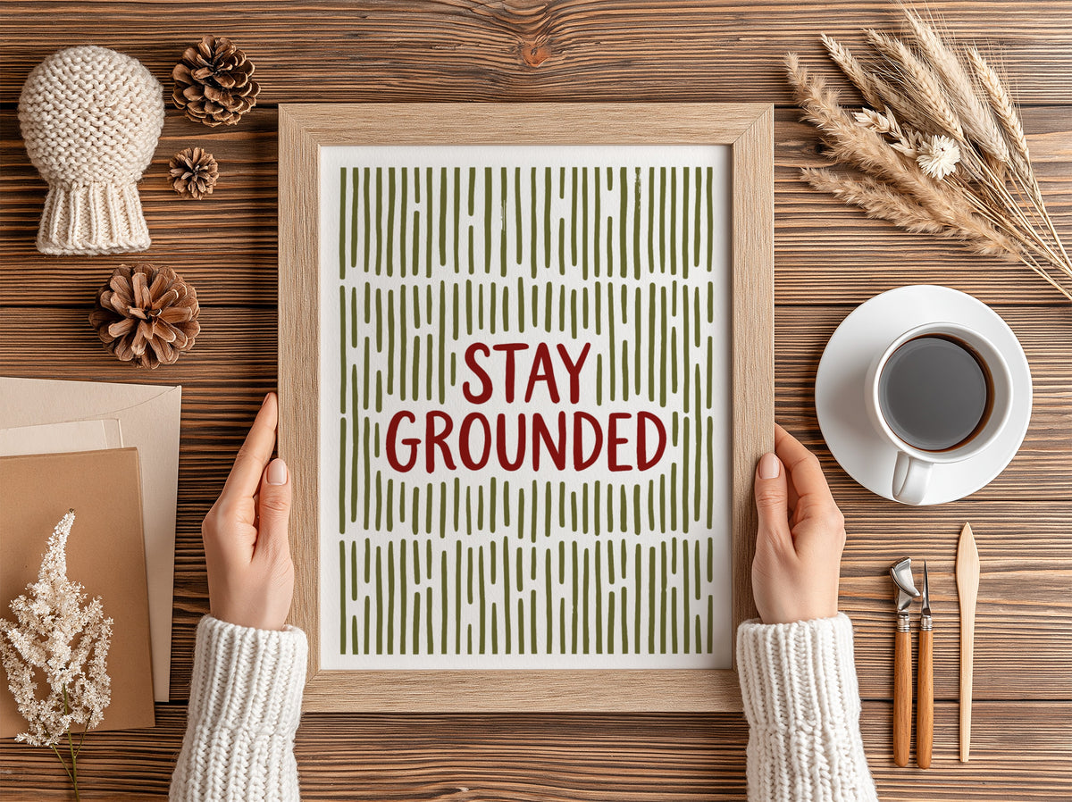 Motivational poster with Stay Grounded text over a pattern of vertical olive lines