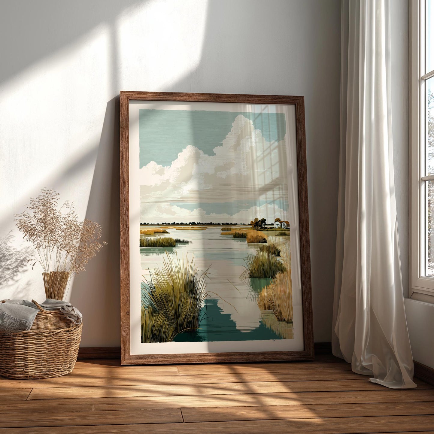 Framed artwork of a landscape with water and sky, placed on a wooden floor.