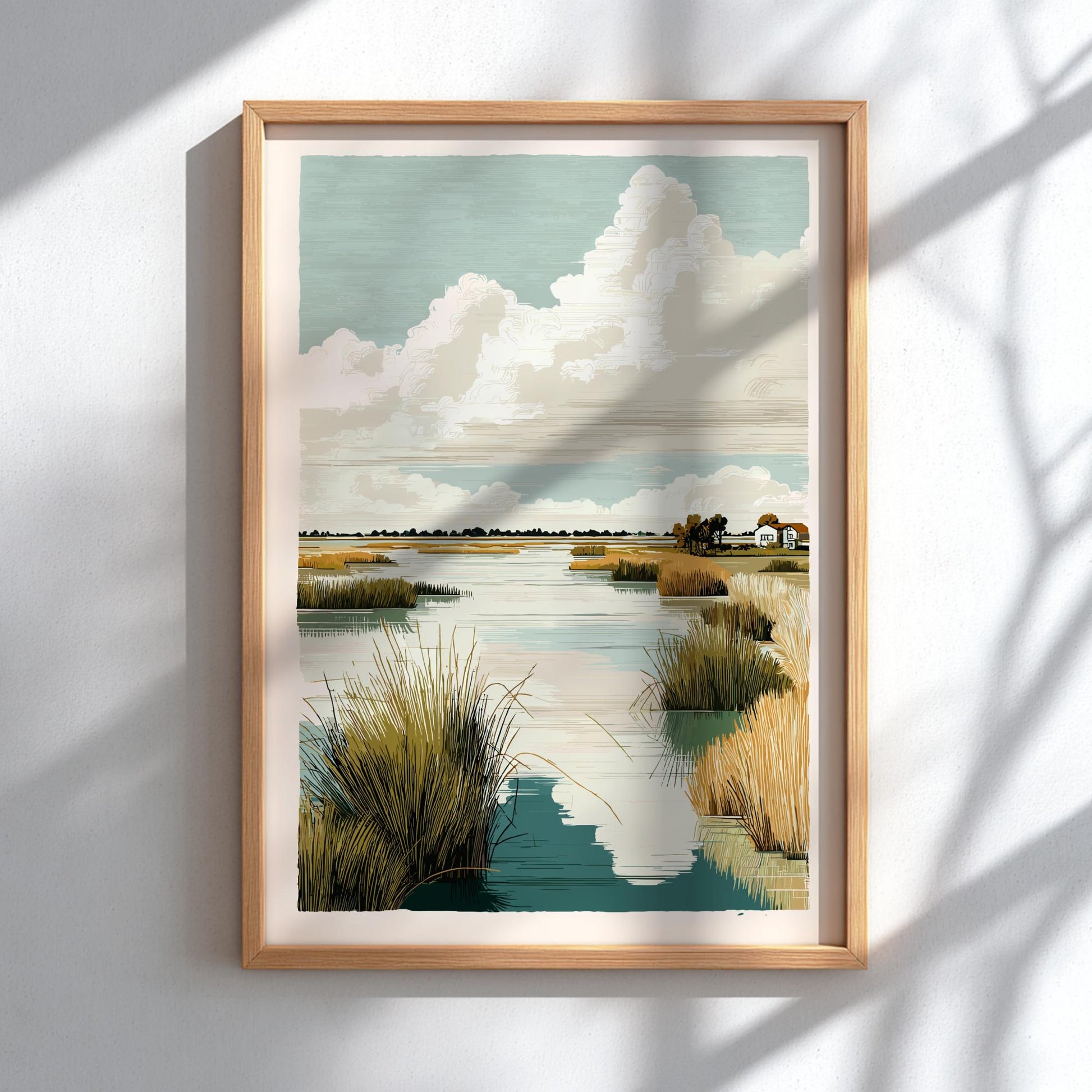 Framed artwork of a landscape with water, grass, and clouds on a white wall.