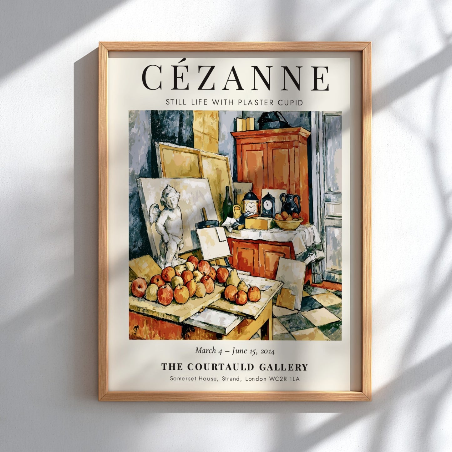 Cézanne exhibition poster featuring Still Life with Plaster Cupid, showcasing warm colors and detailed fruit