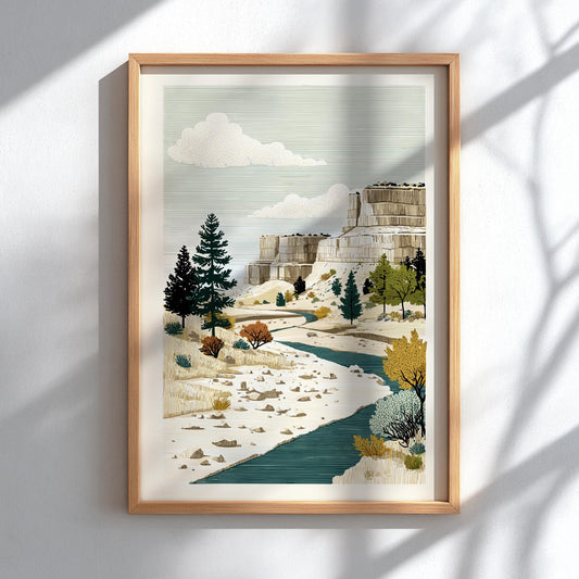 Framed artwork of a mountainous landscape with trees and a stream on a white wall.