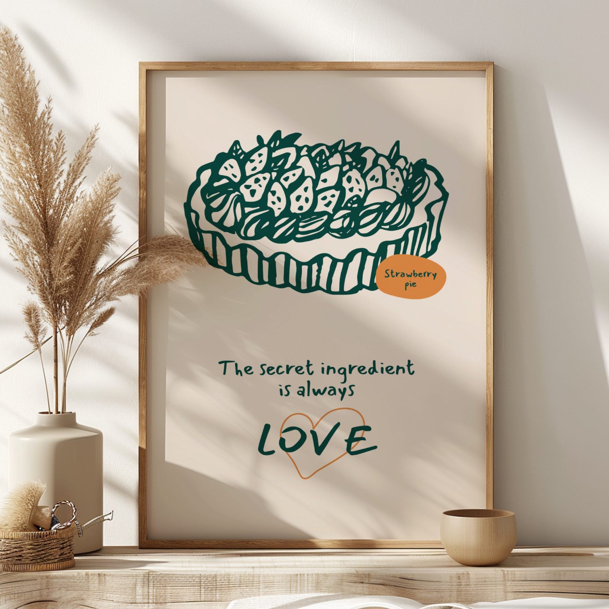 Framed artwork of a strawberry pie with text on a wall with decorative elements.