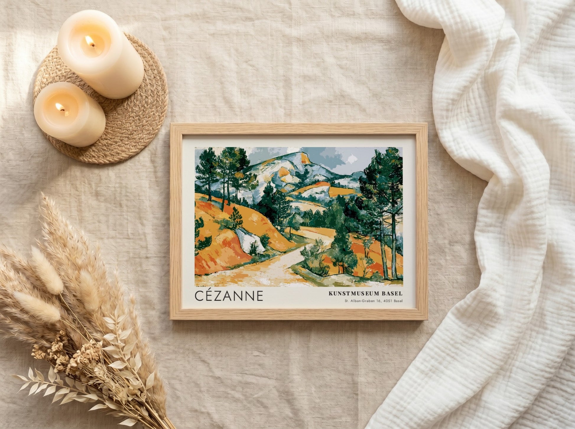 Wall art poster featuring a Cézanne landscape painting with ochre hills and green pines.