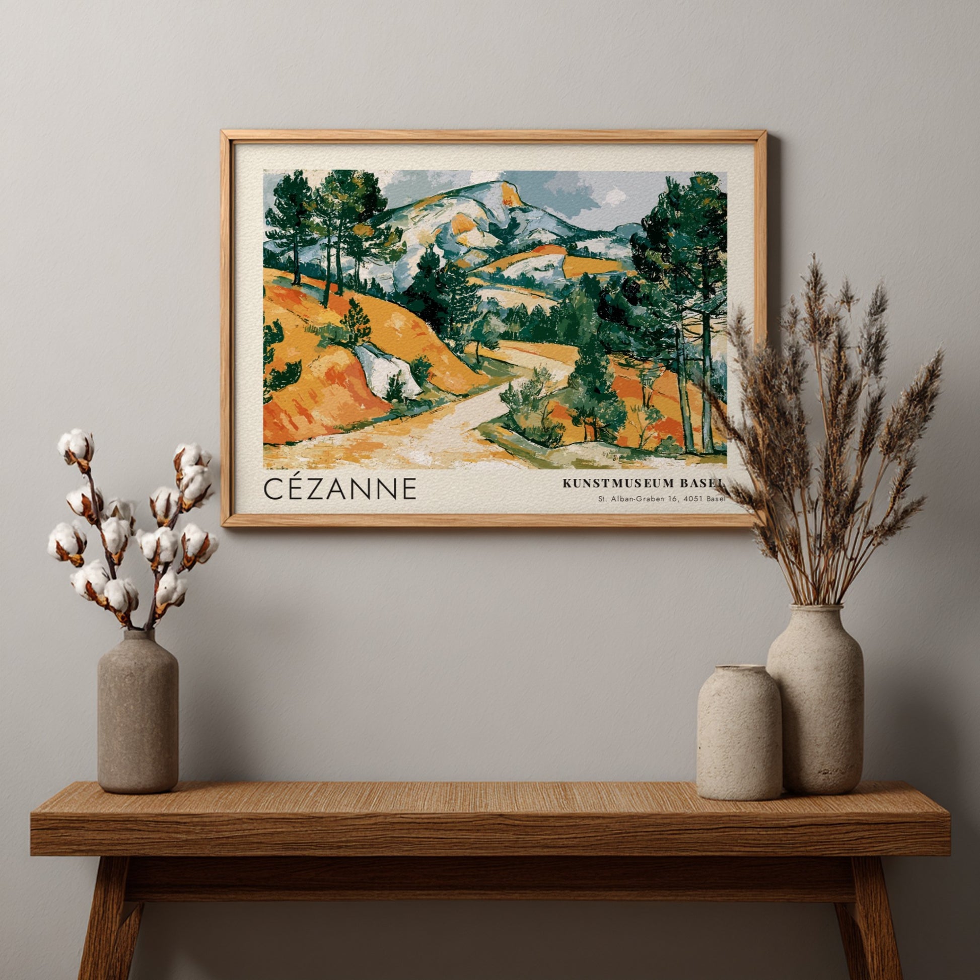 Wall art poster featuring a Cézanne landscape painting with ochre hills and green pines.